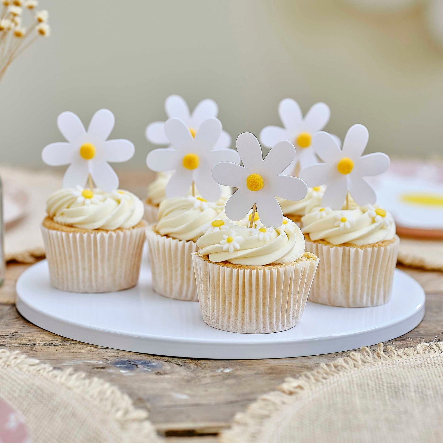 Daisy cupcake toppers with pom poms